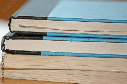 Closeup of a Stack of Books on a Desk