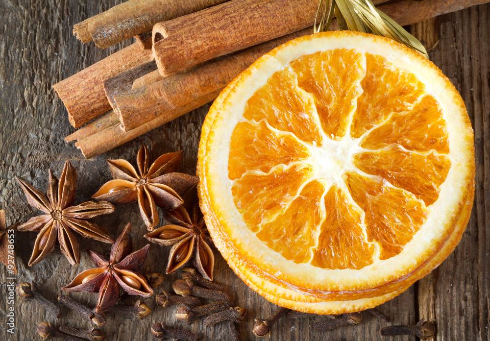 cinnamon sticks, cloves, anise stars and slices of dried citrus cinnamon sticks, cloves, anise stars and slices of dried citrus