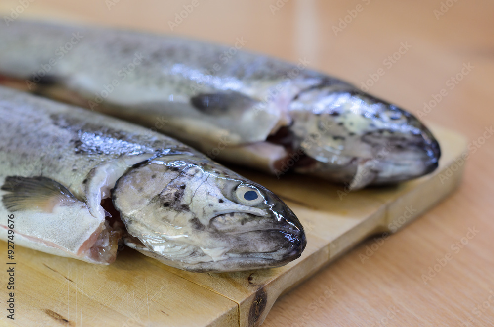 Baked fish Rainbow Trout Stuffed on a Cutting board