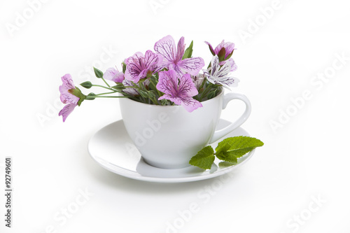 white cup with flowers