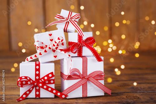 Christmas gift boxes in front of sparkling background