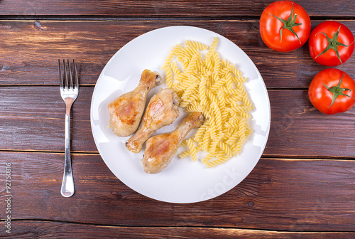 Chicken legs fried with vermicelli and vegetables photo