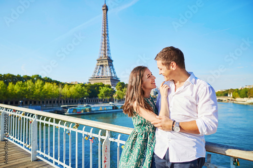 Young romantic couple having a date near the Eiffel tower