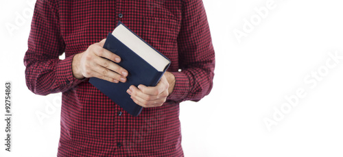 Man holding closed book isolated on white