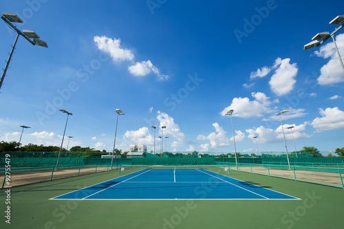 outdoor empty tennis court with blue sky © geargodz