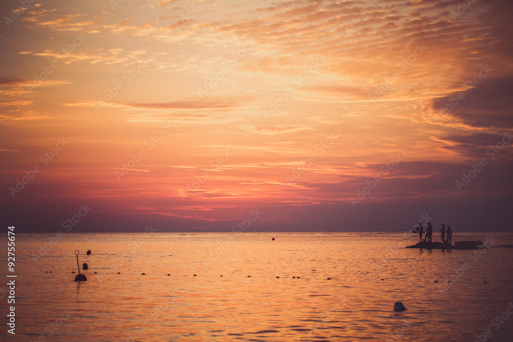 Sea fishing at sunset.