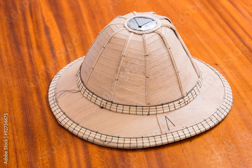 Bamboo sheath hat on wood furniture
