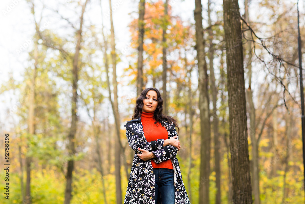 Portrait of young beautiful serious woman standing at autumn Portrait of young beautiful serious woman standing at autumn