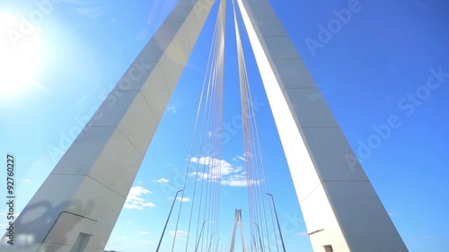 moving on car across bridge on blue sky background