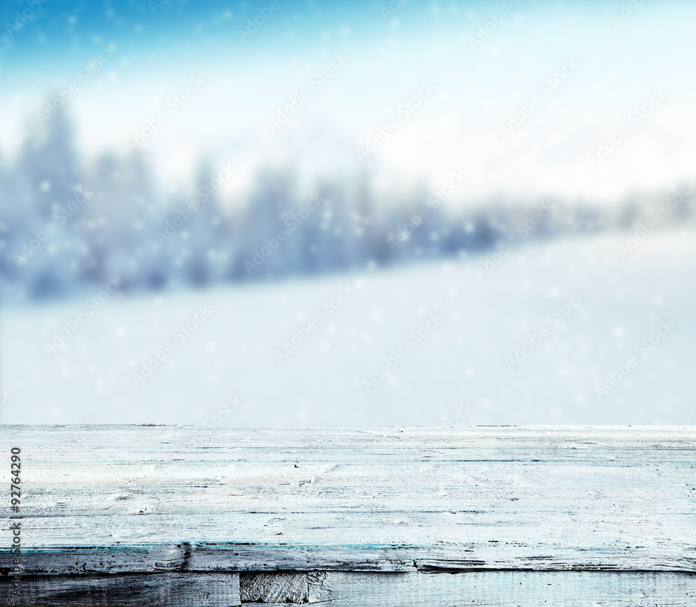 Winter snowy background with wooden planks