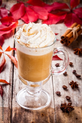 pumpkin latte with whipped cream in a glass jar