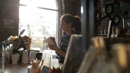 Barista Coffee House wrote the name on the cup and smiling