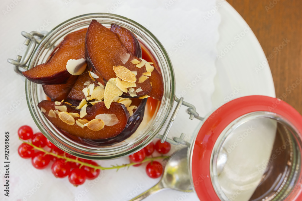 plum dessert with yoghurt and roasted almonds plum dessert with yoghurt and roasted almonds