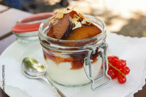 plum dessert with yoghurt and roasted almonds