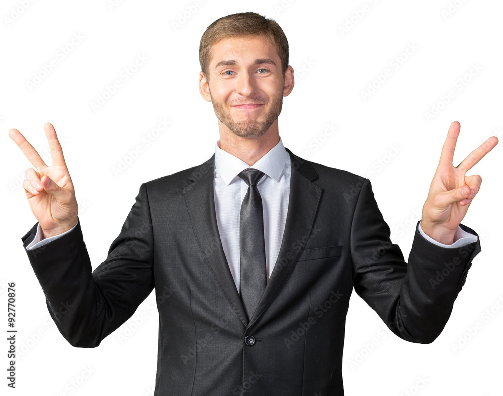 Businessman showing victory sign Businessman showing victory sign