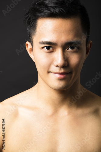 Closeup portrait of attractive young man face © Tom Wang