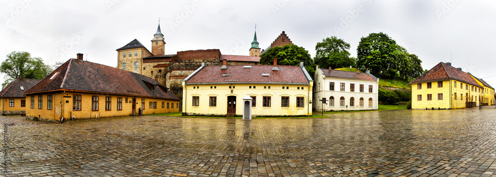 Panoramic view of Akershus Fortress in rainy day. Oslo. Norway. Akershus Fortress is a medieval castle that was built to protect Oslo, the capital of Norway. It has also been used as a prison. 