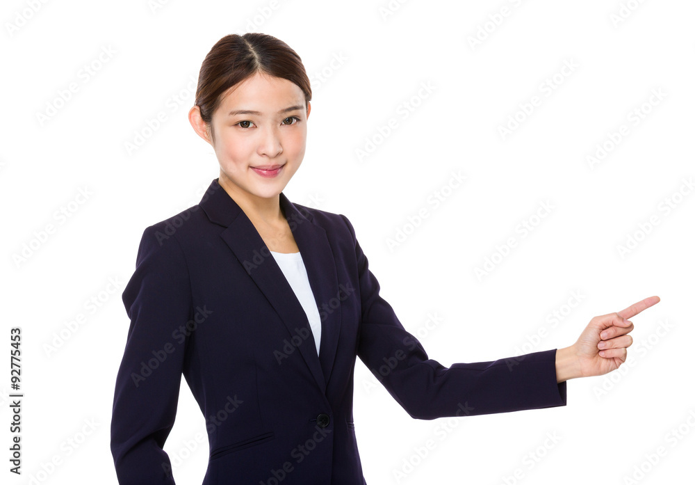 Asian young businesswoman with finger point aside Asian young businesswoman with finger point aside