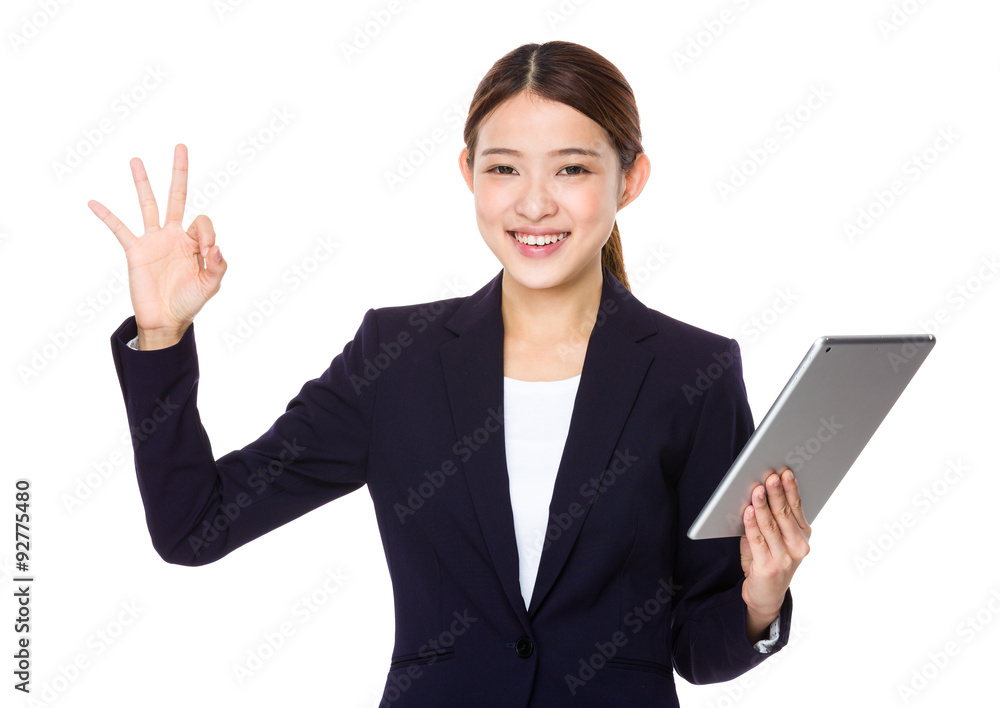 Businesswoman hold with tablet pc and ok sign gesture Businesswoman hold with tablet pc and ok sign gesture