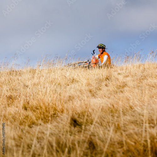 Biker riding in autumn mountains