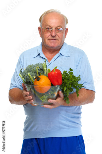Senior man with vegetables.