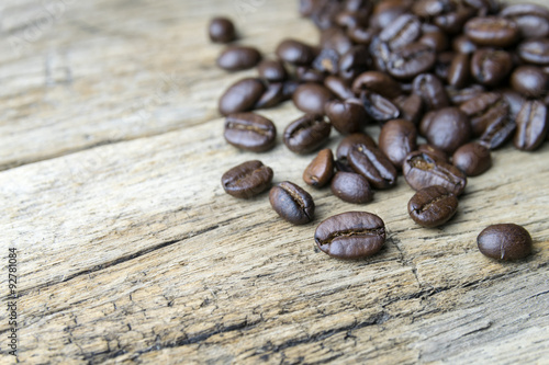 Coffee beans on wood background