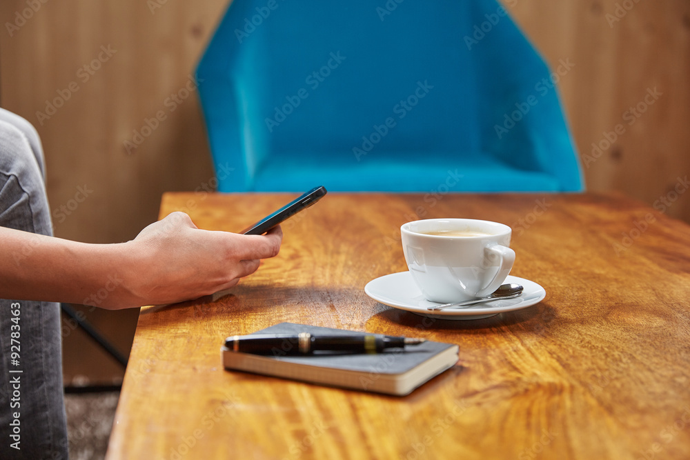 Woman with mobile phone in cafe Woman with mobile phone in cafe