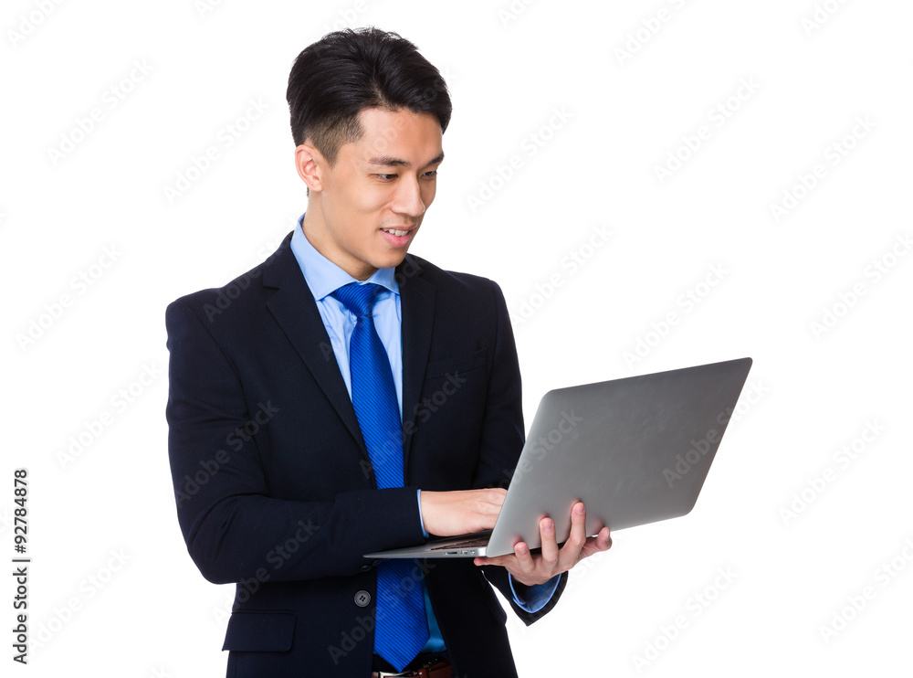 Young businessman use of the laptop computer Young businessman use of the laptop computer