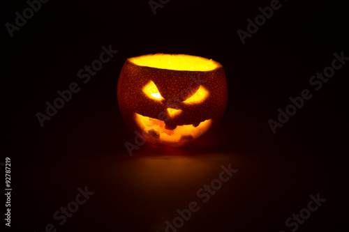 halloween orange fruit jack lantern on dark