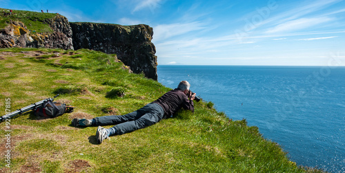 Photographer in Latrabjarg Cliffs, Westfjords, Iceland