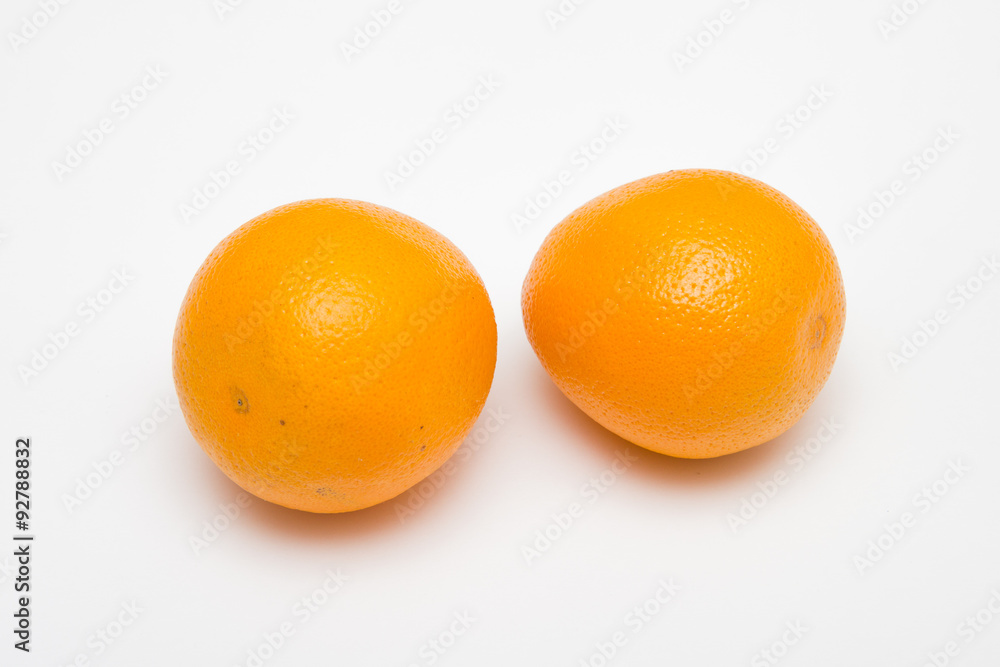 two orange fruit isolated on white backgrounds two orange fruit isolated on white backgrounds