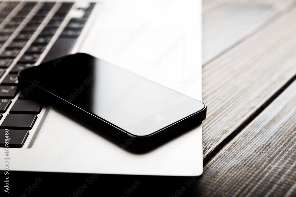 keyboard with phone and tablet pc on wooden desk keyboard with phone and tablet pc on wooden desk