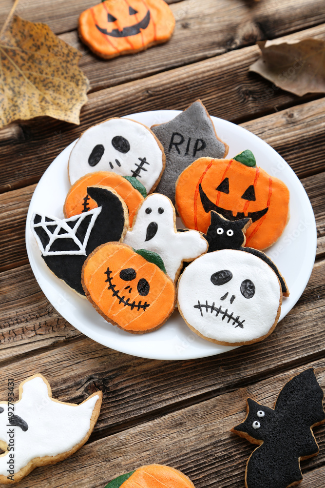 Fresh halloween gingerbread cookies on brown wooden table