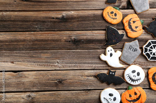 Fresh halloween gingerbread cookies on brown wooden table