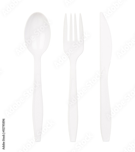 White plastic spoon, fork and knife isolated on white background