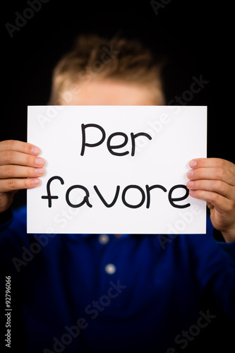 Child holding sign with Italian word Per Favore - Please