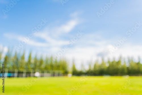 blurred image of soccer field at school on day time image