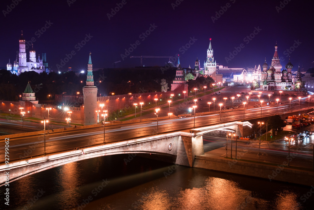 Fototapeta premium Night aerial panorama to Bolshoy Moskvoretsky Bridge, Vasilevsky Descent, towers of Moscow Kremlin, Saint Basil Cathedral and Moskva river