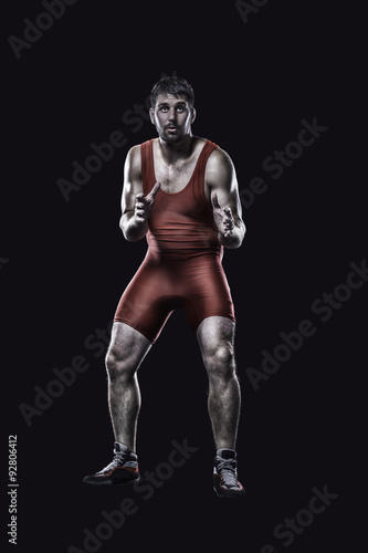 Freestyle wrestler in red uniform 