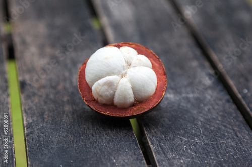 mangosteens on a wooden table photo