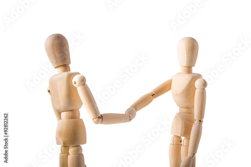 Two puppets shaking hands