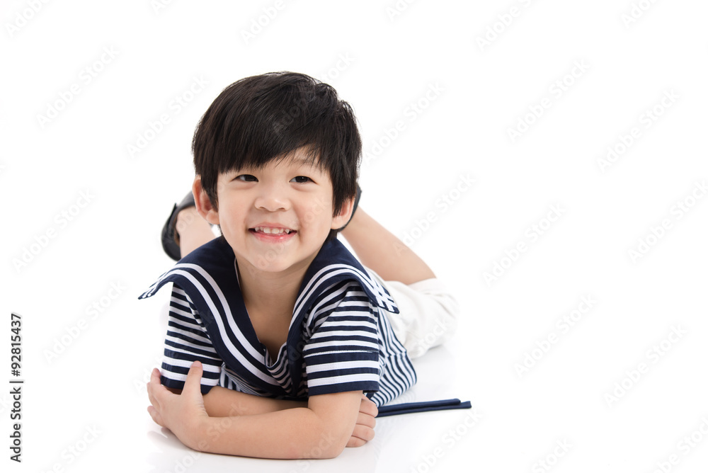 Cute asian boy lying on white background isolated Cute asian boy lying on white background isolated