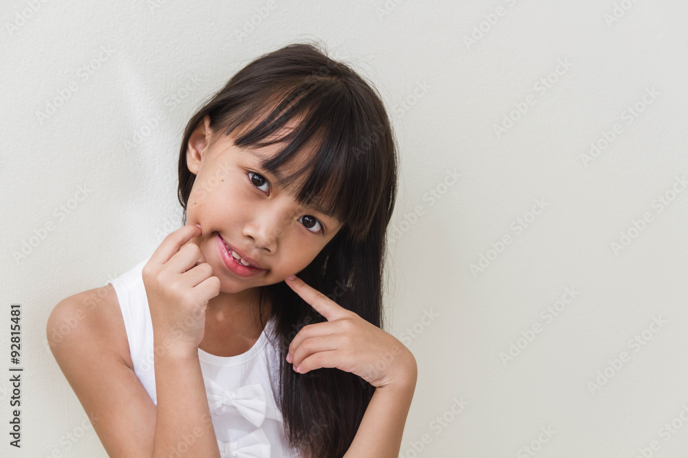 Happy little asian girl isolated in white Happy little asian girl isolated in white