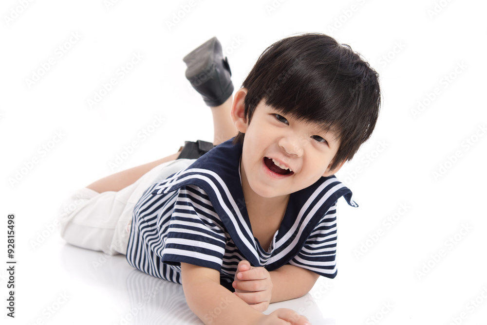 Cute asian boy lying on white background isolated Cute asian boy lying on white background isolated