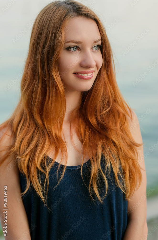 Smiling redhead young woman. Smiling redhead young woman.