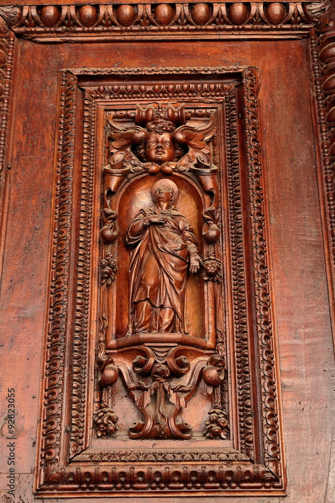 Detail of the old entrance door in Italian church