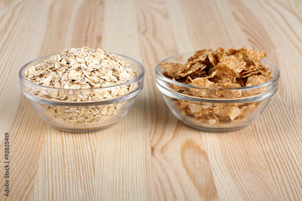 cereals and oatmeal in a bowl on wooden background cereals and oatmeal in a bowl on wooden background
