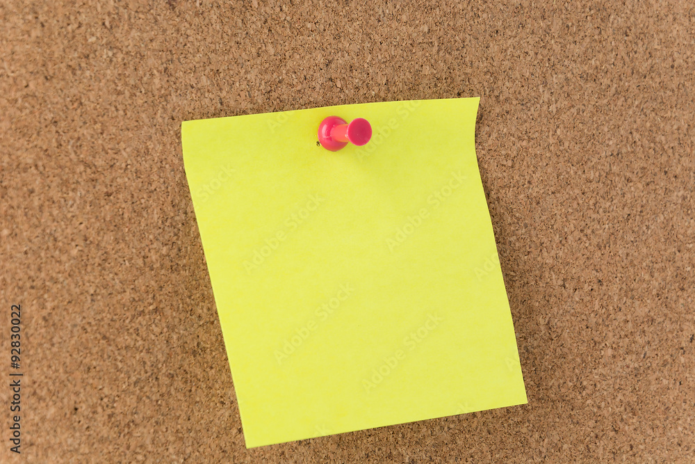 sticky note on cork board sticky note on cork board