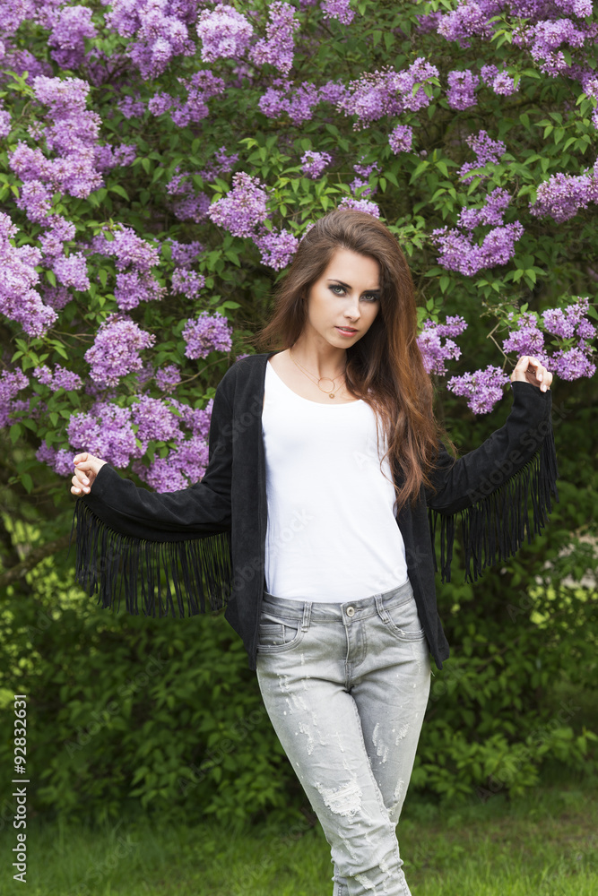 fashion female in pose in the park fashion female in pose in the park