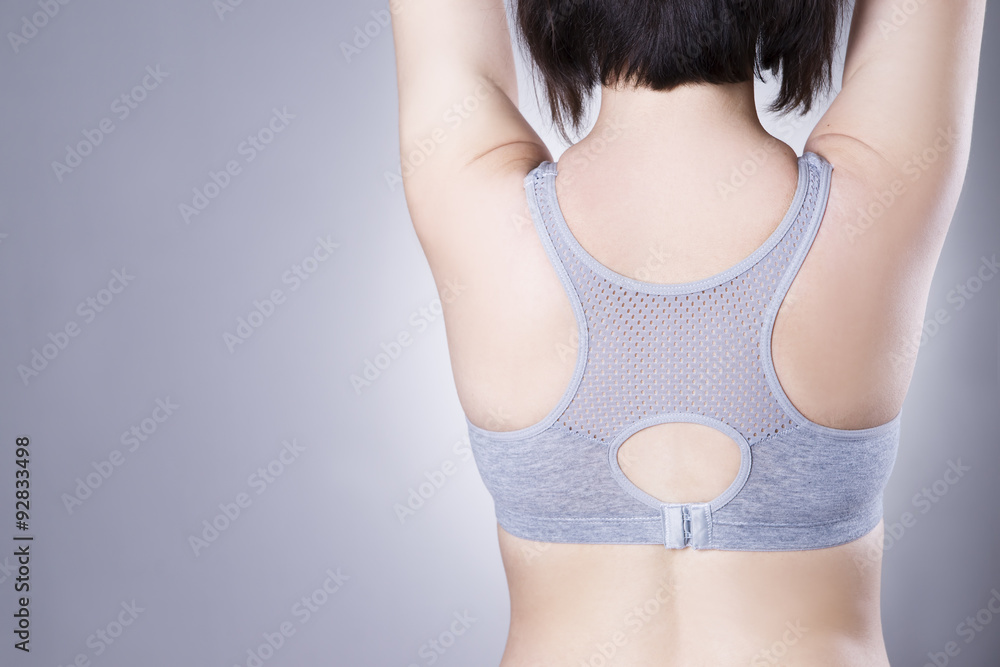 Closeup of a woman undressing and unhooking her bra. Woman taking off her  bra Stock Photo | Adobe Stock